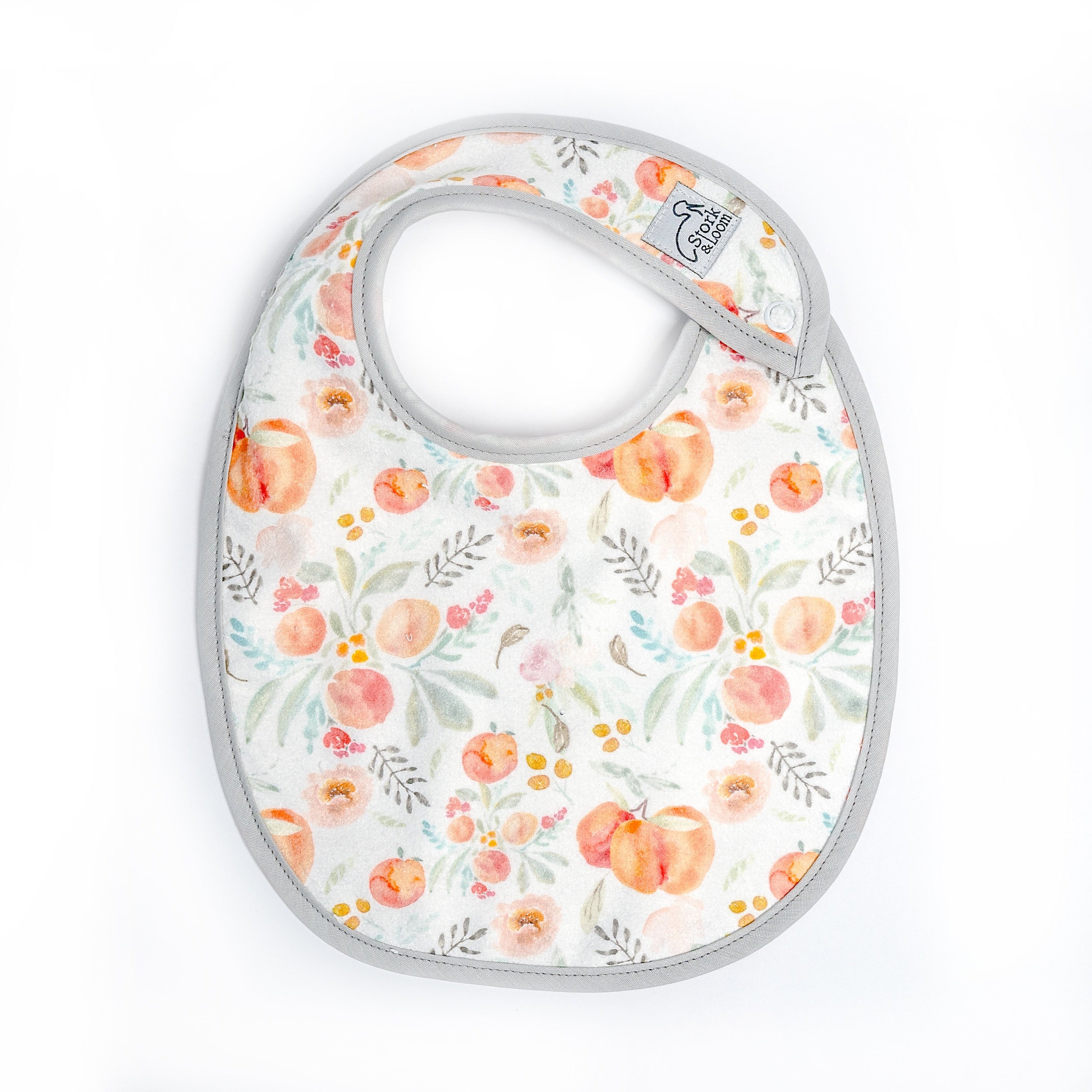 SINGLE LAYERED DESIGNED TERRY CLOTH BABY BIB WITH PEACH PRINT, PEARL GREY BINDING, WHITE CLOSURE, BABY BIB, BIB